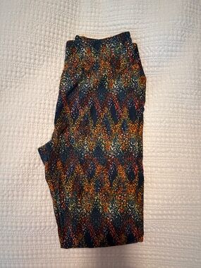LuLaRoe Navy Leggings with Orange, Yellow & Red Abstract Pattern